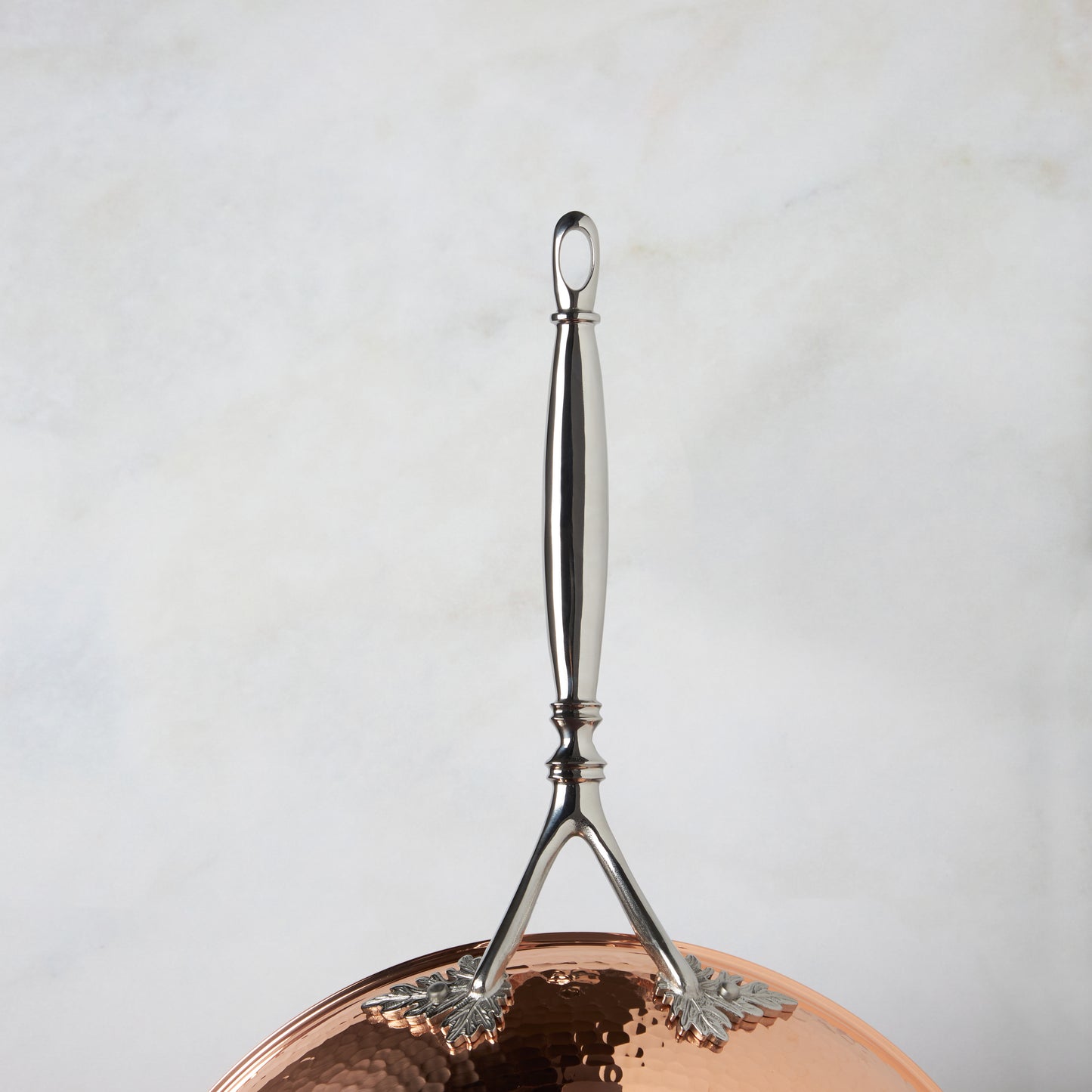 Beautiful Opus Cupra stainless steel long stick handle decorated with delicate leaves on Opus Cupra cookware by Ruffoni