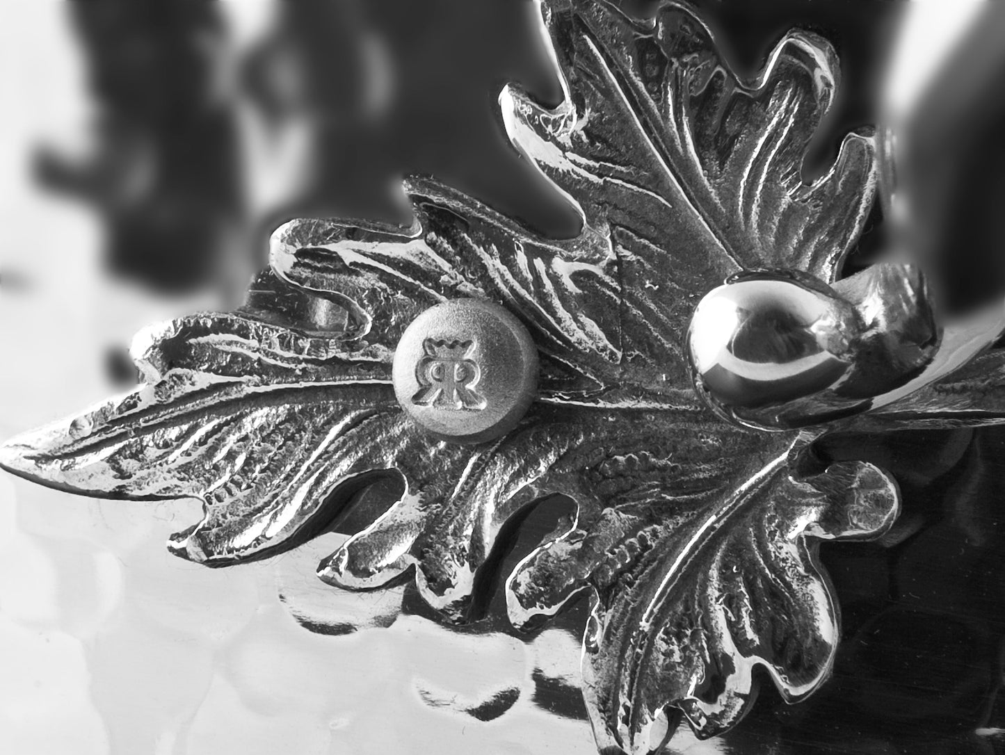 Beautiful stainless steel handle decorated with delicate leaves on Opus Prima cookware by Ruffoni