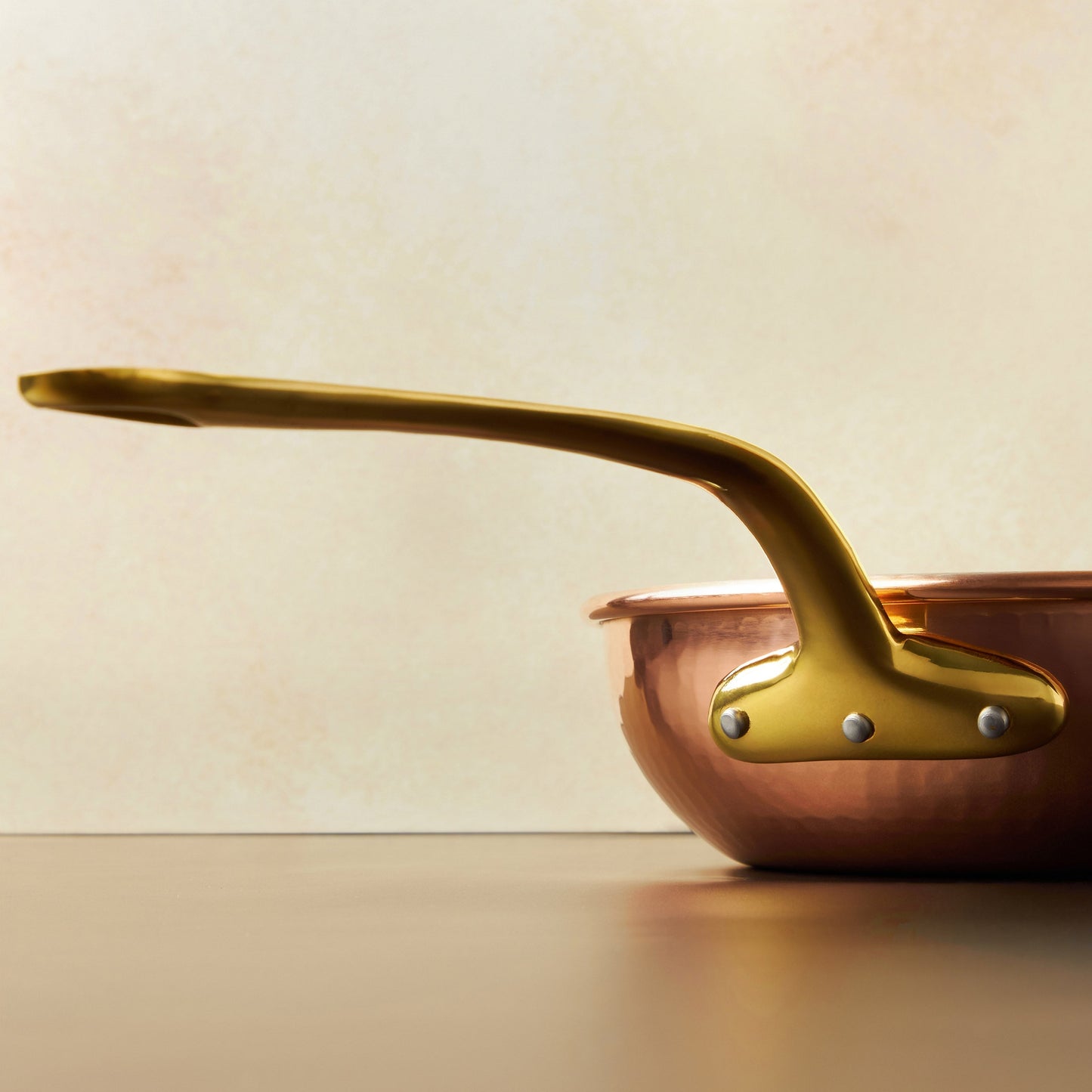 Beautiful bronze long stick handle on Historia cookware by Ruffoni