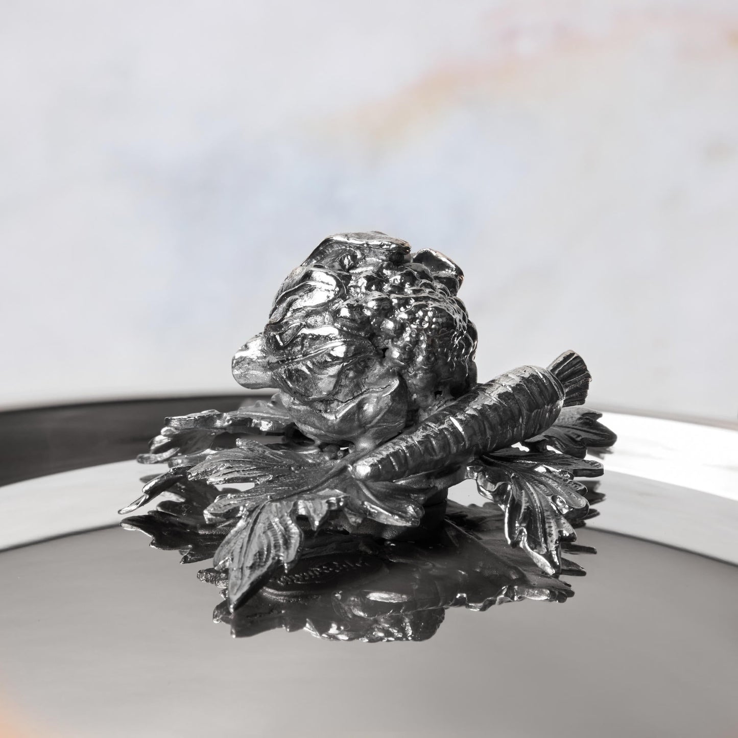 Decorated knob finial representing cauliflower and carrot, cast in solid bronze and silver plated, on Opus Prima stainless steel lid by Ruffoni
