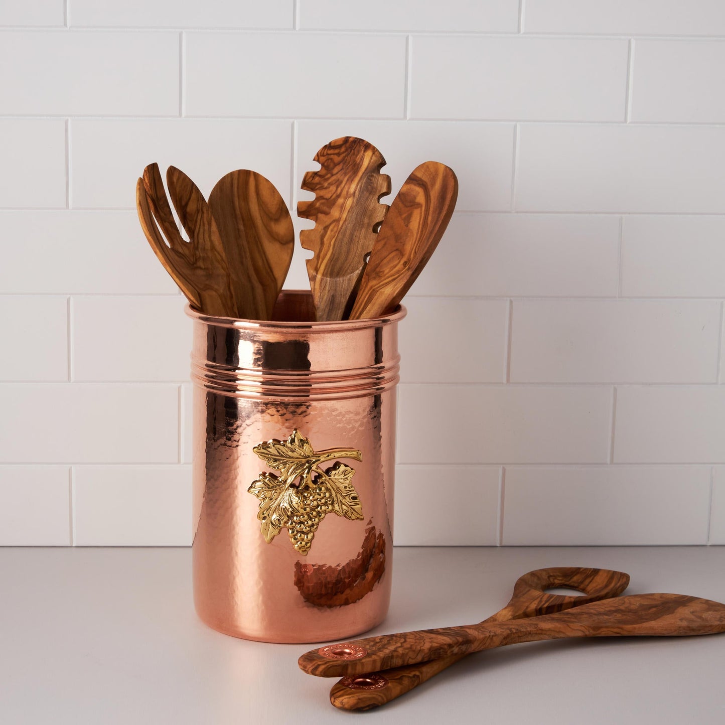 Container for kitchen utensils, made of solid copper, decorated with a bronze plaque depicting grapes, by Ruffoni
