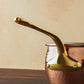 Beautiful bronze long stick handle on Historia cookware by Ruffoni