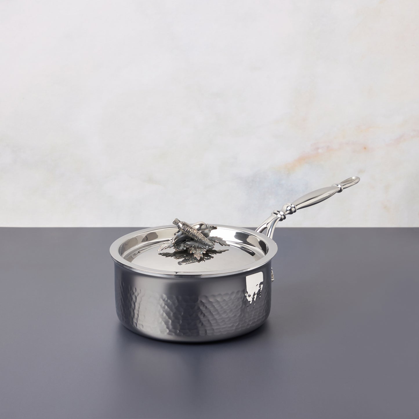 Opus Prima hammered clad stainless steel small saucepan with decorated silver-plated lid knob finial from Ruffoni