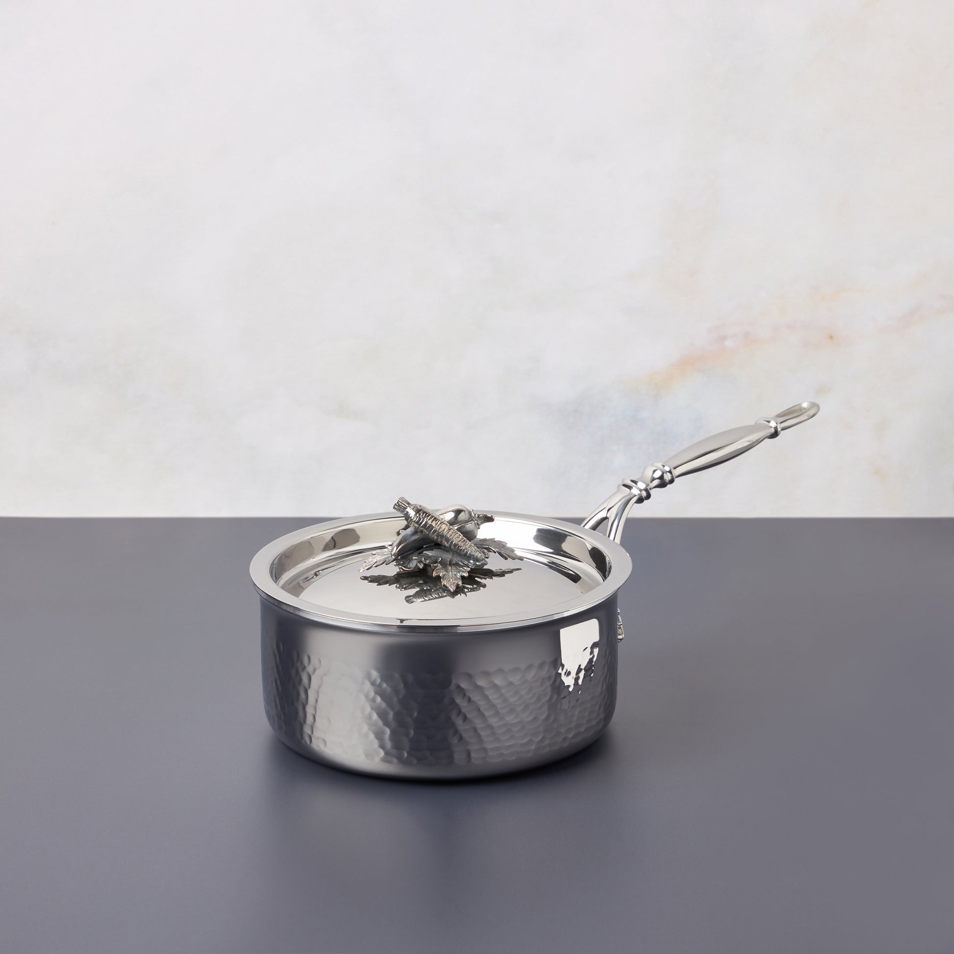Opus Prima hammered clad stainless steel small saucepan with decorated silver-plated lid knob finial from Ruffoni