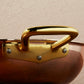 Riveted brass side handle on Ruffoni Olivia Cupra copper cookware