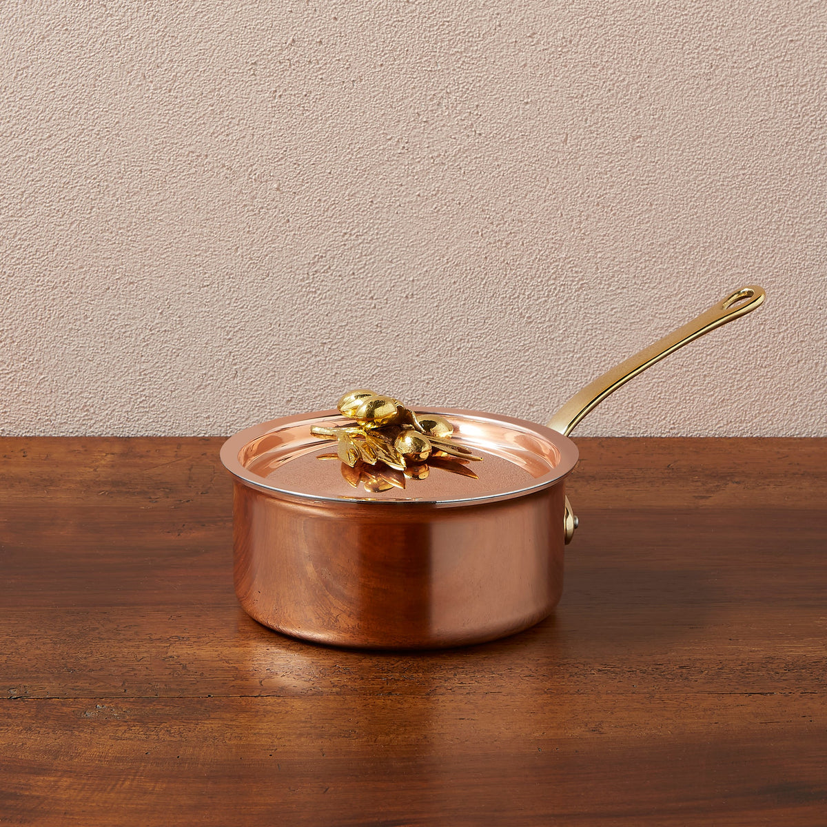 Ruffoni Olivia Cupra 1.5qt saucepan copper cookware with stainless steel lining, brass handles, and decorated lids with brass olive and leaf knob finials
