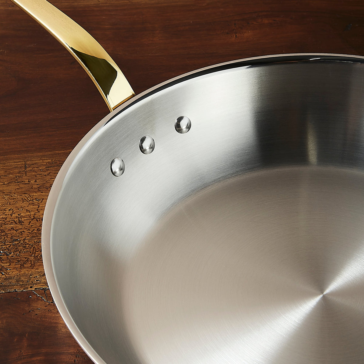 Polished stainless steel interior of a Ruffoni Olivia Cupra copper with brass handle