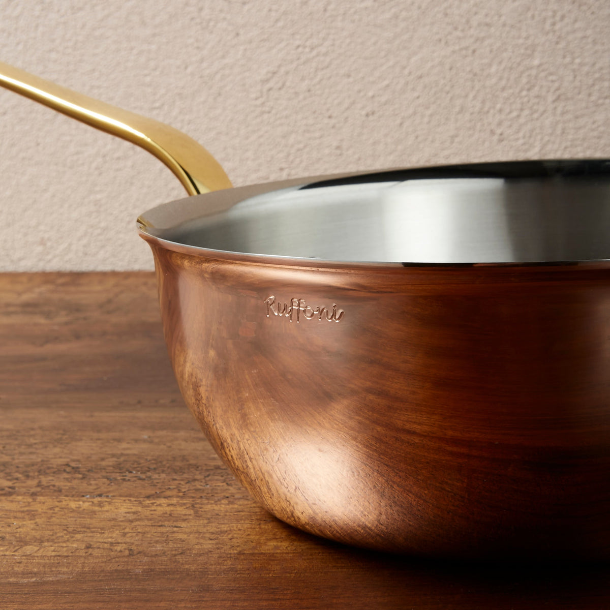 Ruffoni signature engraved on the polished copper exterior of Olivia Cupra cookware