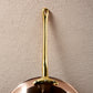 Long brass stick handle riveted to a Ruffoni Olivia Cupra copper frying pan