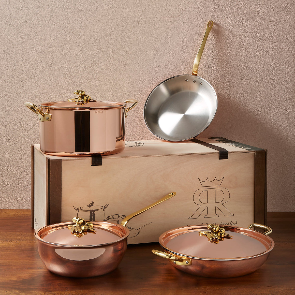 Ruffoni Olivia Cupra 7-piece copper cookware set with stainless steel lining, brass handles and decorated lids with brass olive and leaf knob finials