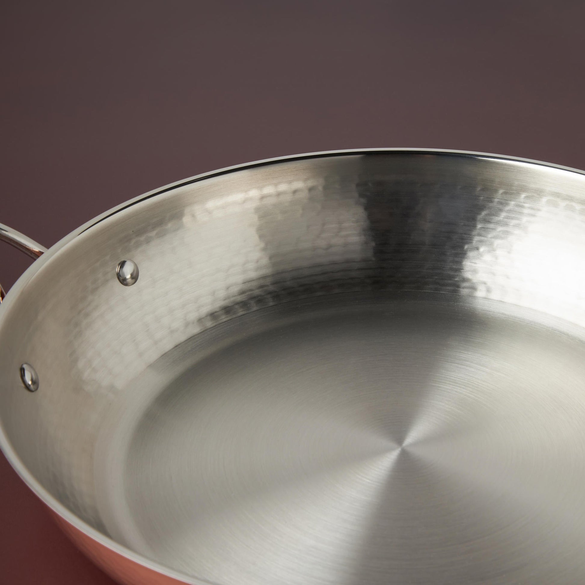 Sunray polished and hammered stainless steel lining in Opus Cupra skillet from Ruffoni