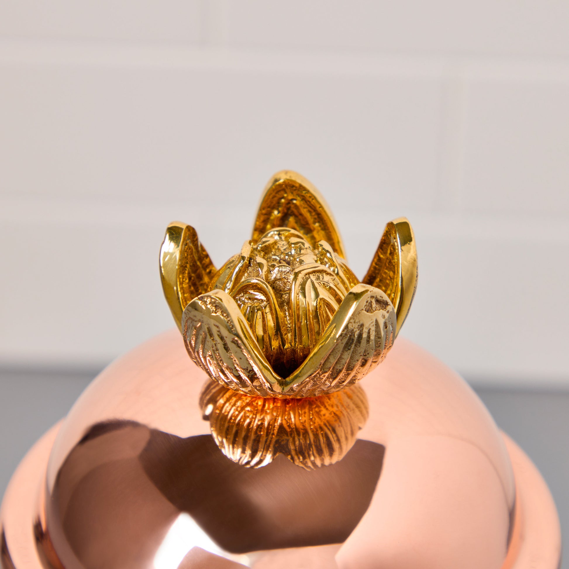 copper lid with bronze lotus flower finial