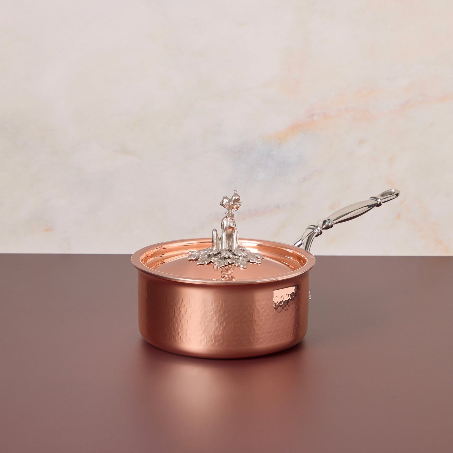 Disney x Ruffoni Opus Cupra 2 qt saucepan hammered copper with special edition Disney-inspired knobs in stainless steel featuring Pluto, by Ruffoni