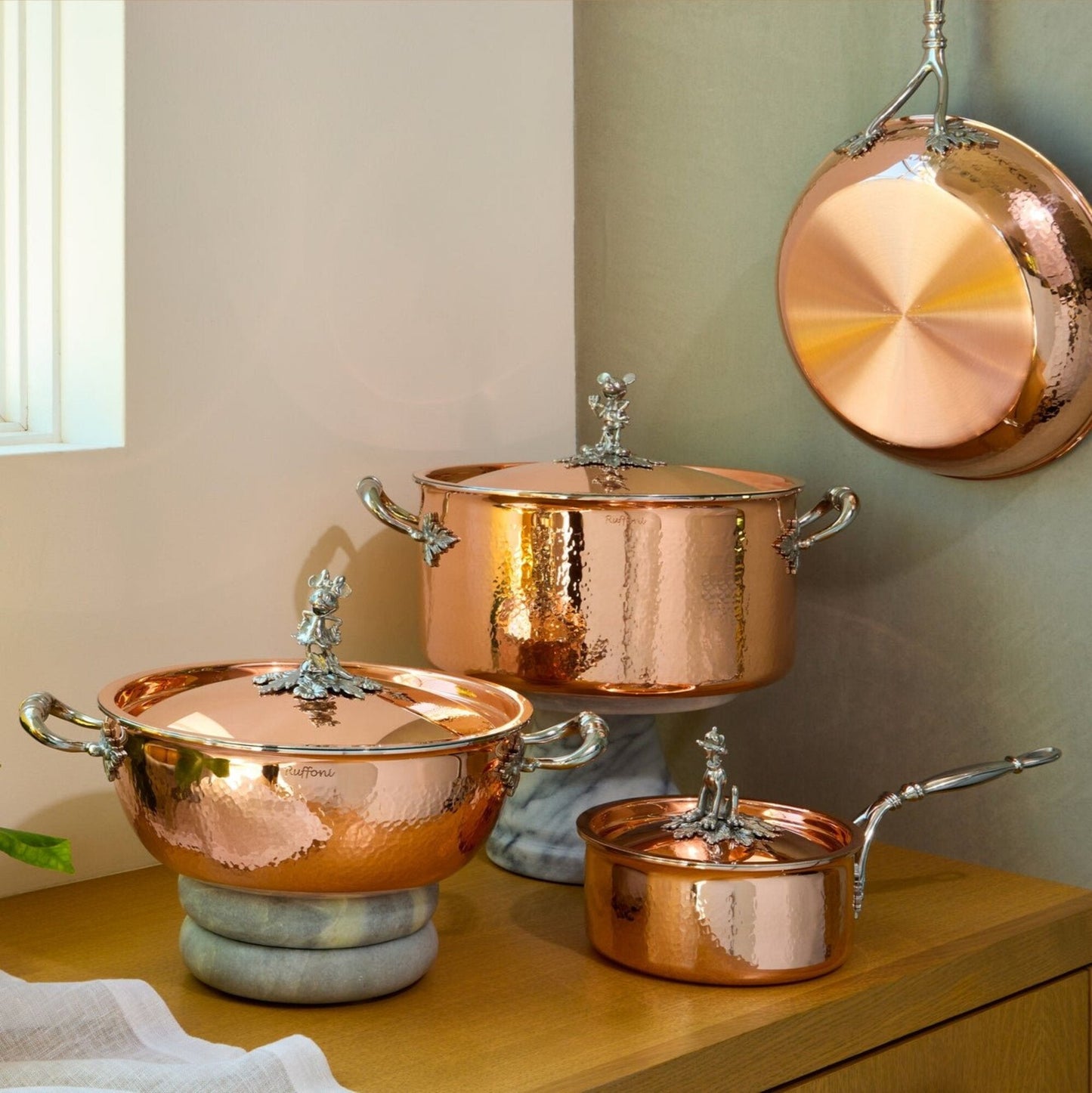 7 piece set  Disney x Ruffoni Opus Cupra hammered copper  with stainless steel lining and decorated stainless steel finial from Ruffoni