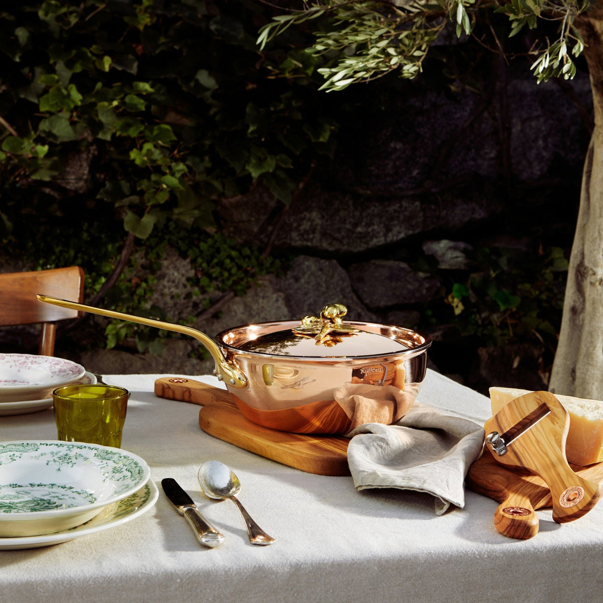 Olivia Cupra copper Chef Pan on a linen tablecloth