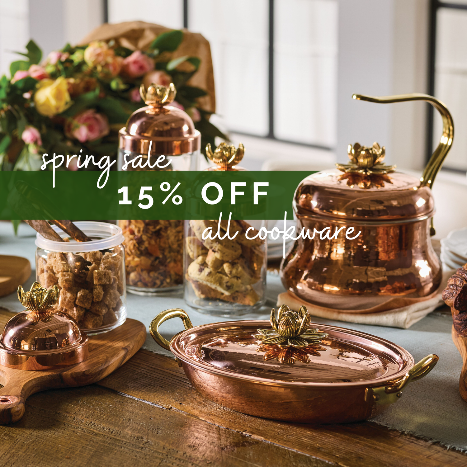 Copper cookware set on a table with a spring sale banner overlay.