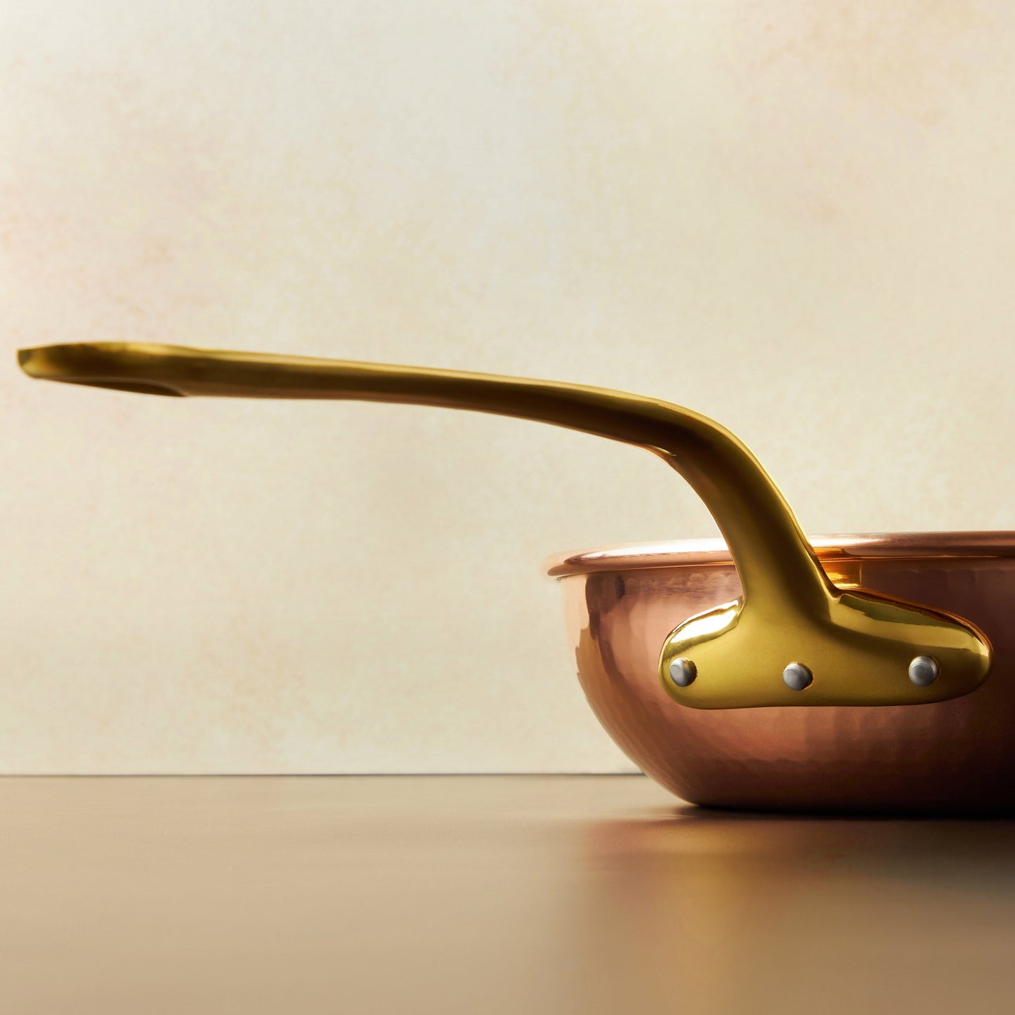 Beautiful bronze long stick handle  on Historia cookware by Ruffoni