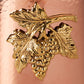 detail of the bronze grape medallion of Ruffoni copper utensil holder