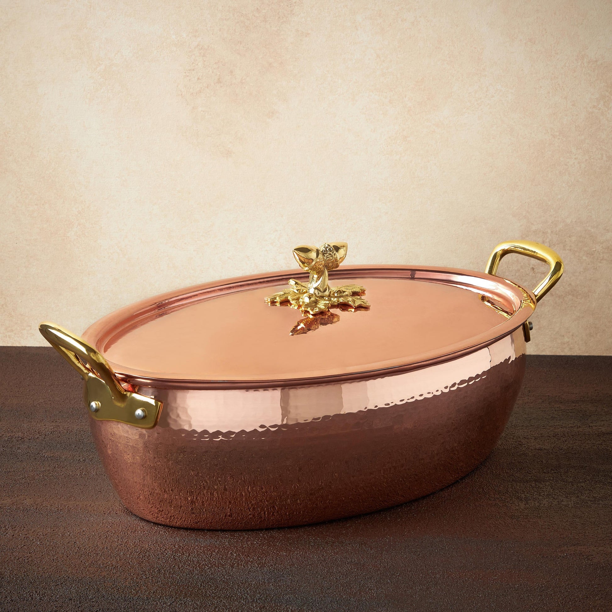 Hammered copper 8 Qt Oval Casserole lined with high purity tin applied by hand over fire and bronze handles, from Ruffoni Historia collection