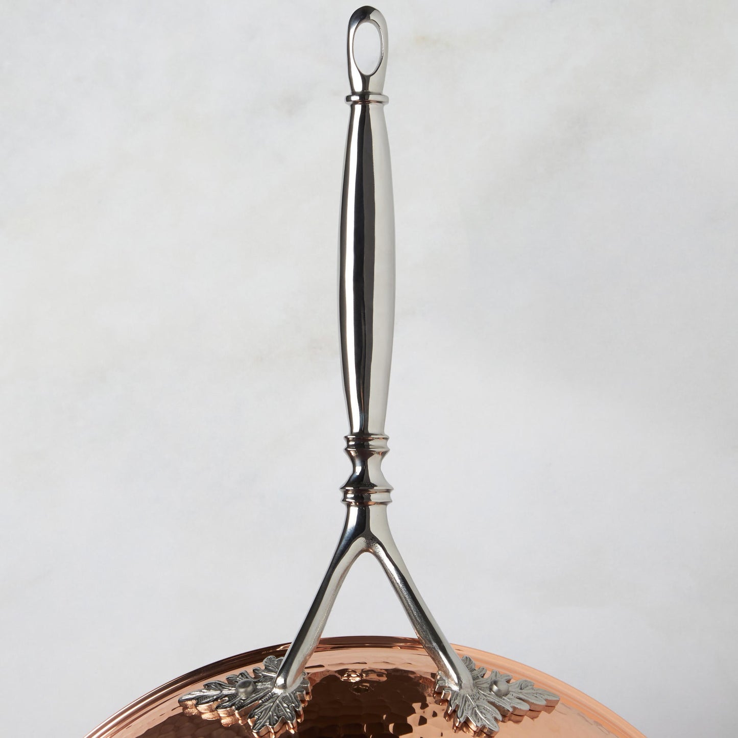 Beautiful Opus Cupra stainless steel long stick handle decorated with delicate leaves on Opus Cupra cookware by Ruffoni